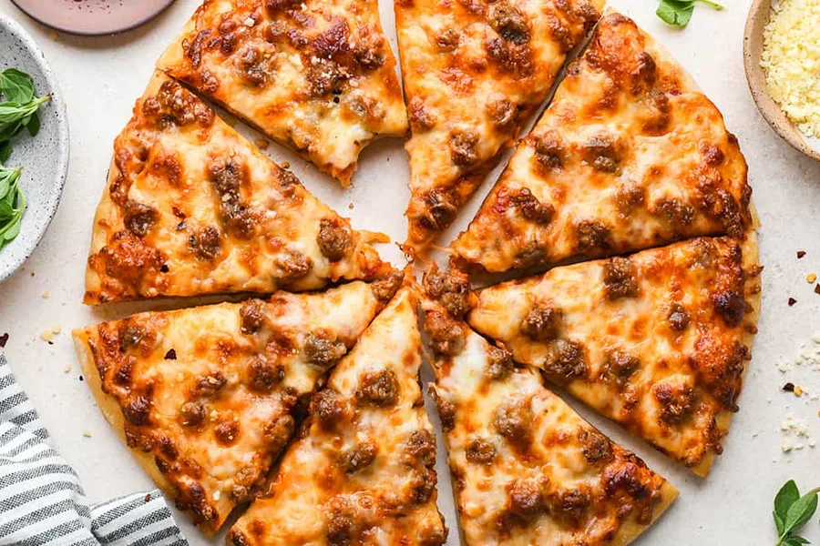 Detroit-style deep dish pizza in a steel pan