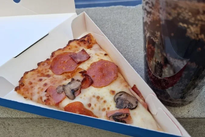 Lunch Combo, a hot pizza slice with a cold drink