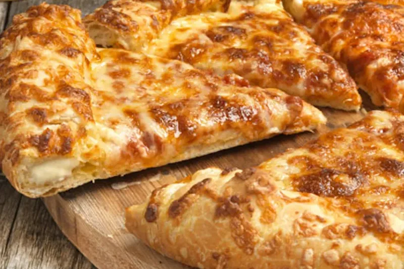 Pretzel Crust cheese pizza with a glossy golden-brown crust