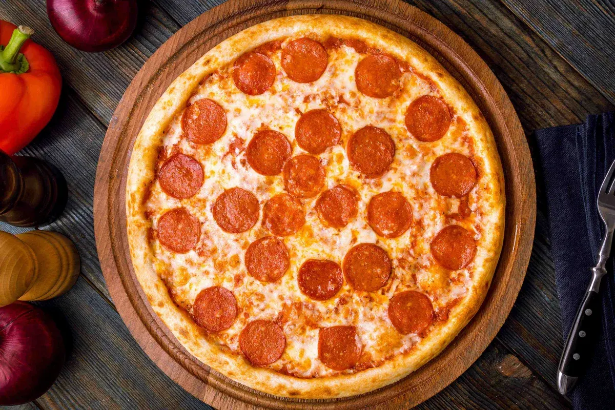 Classic round pizza viewed from above, fresh from the oven